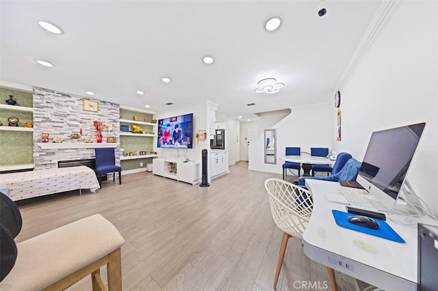 living room with ornamental molding, light wood-type flooring, built in features, and recessed lighting