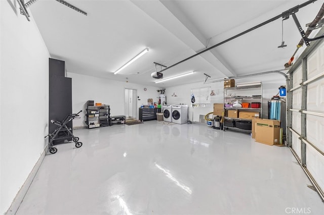 garage featuring a garage door opener and washing machine and dryer