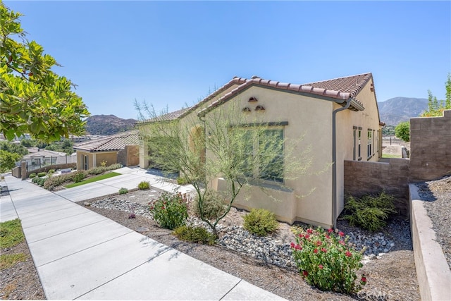 view of home's exterior with a mountain view