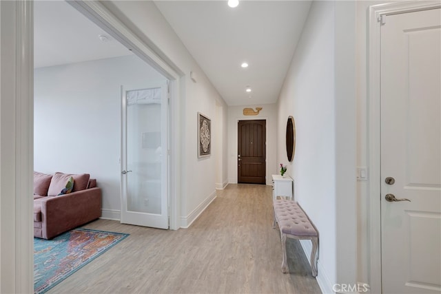 hall with light hardwood / wood-style flooring