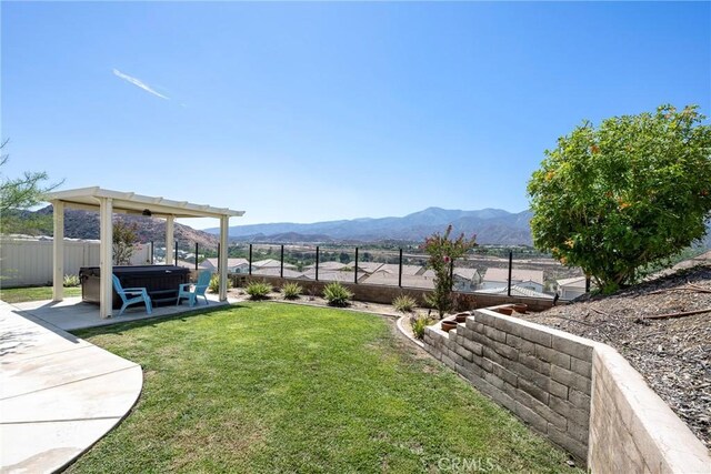 view of yard featuring a patio and a mountain view