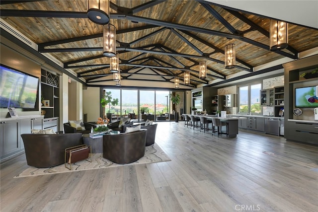 living room with wood ceiling, light hardwood / wood-style floors, a notable chandelier, beam ceiling, and high vaulted ceiling