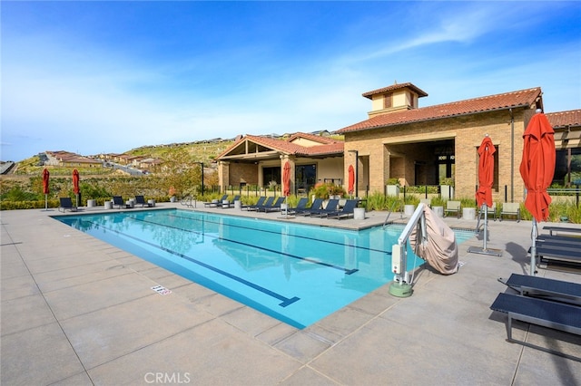 view of pool featuring a patio