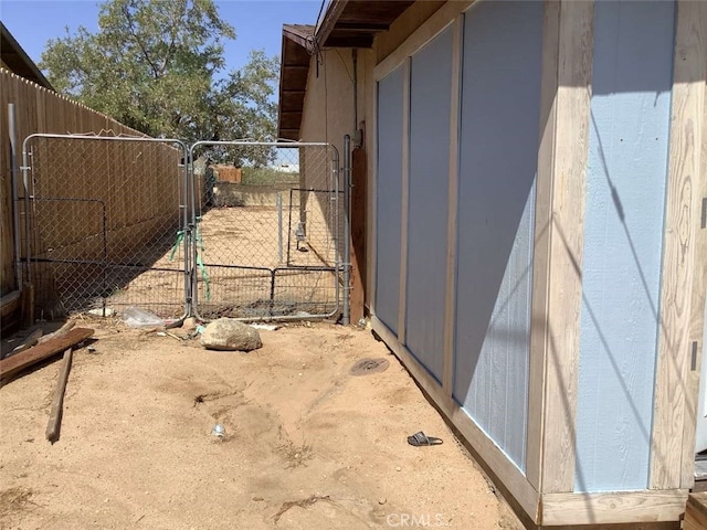 5645 Cahuilla Ave Unit 29, Palms, CA 92277 - view of side of home with a gate