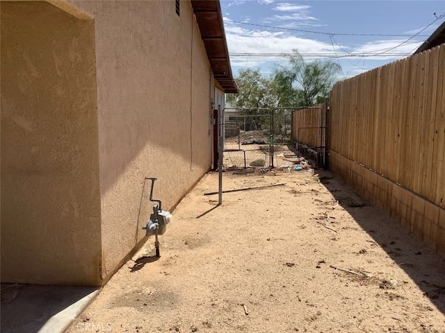 5645 Cahuilla Ave Unit 29, Palms, CA 92277 - view of side of home featuring stucco siding