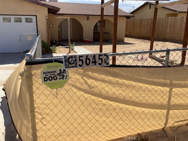 5645 Cahuilla Ave Unit 29, Palms, CA 92277 - view of patio with a garage