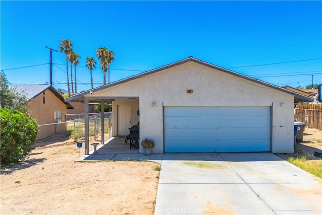 ranch-style house featuring a garage