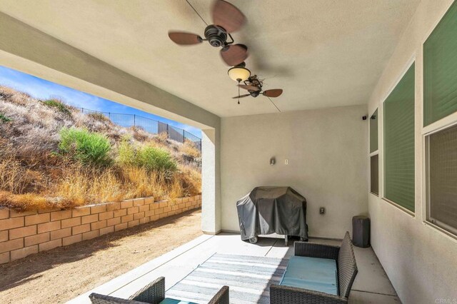 view of patio / terrace with area for grilling and ceiling fan