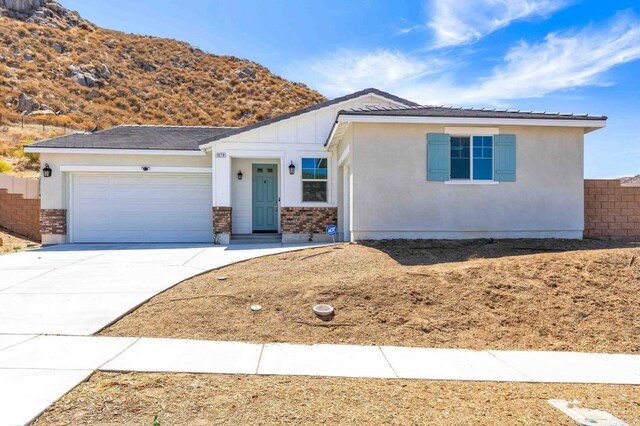 view of front of home featuring a garage and a mountain view