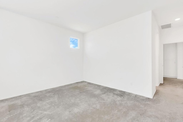 spare room with light colored carpet