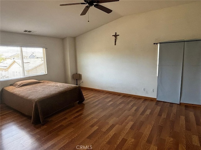 bedroom featuring lofted ceiling, ceiling fan, and dark hardwood / wood-style floors