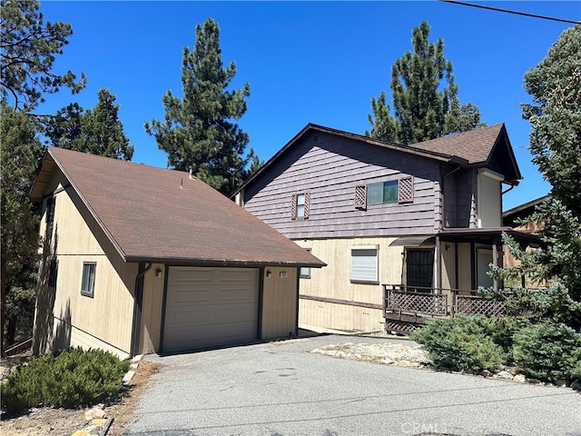 front of property featuring a garage and a porch