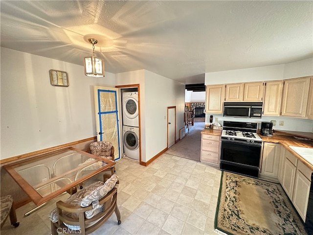 kitchen featuring pendant lighting, stacked washer / dryer, a textured ceiling, light brown cabinetry, and stove