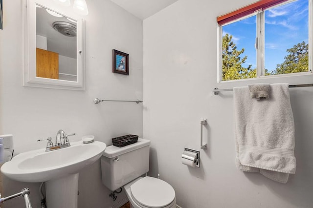 bathroom featuring sink and toilet