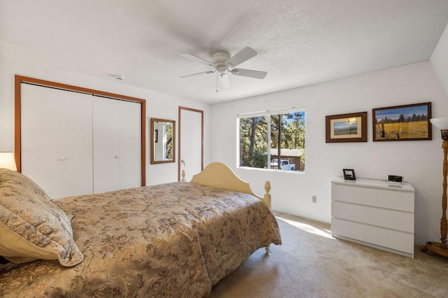 bedroom with ceiling fan and light colored carpet