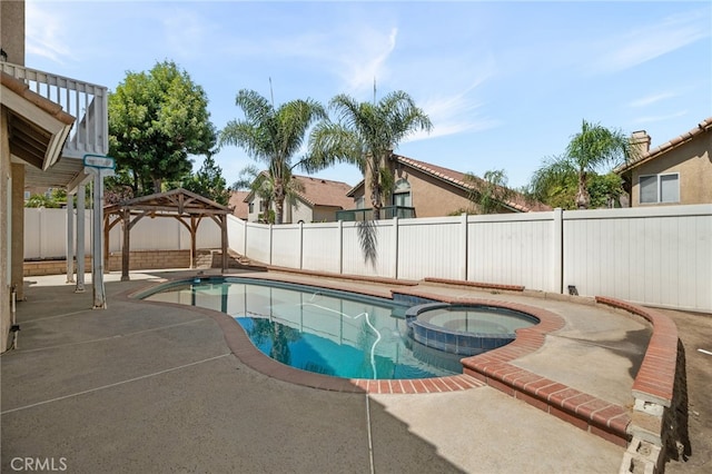 view of pool with an in ground hot tub, a gazebo, and a patio area