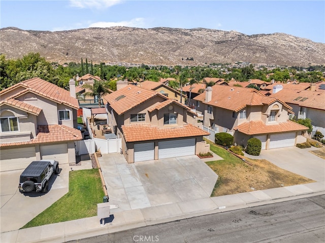 drone / aerial view featuring a mountain view