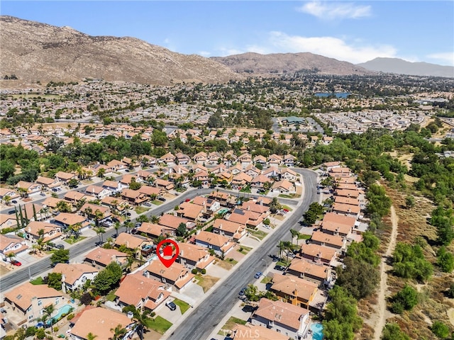 birds eye view of property with a mountain view