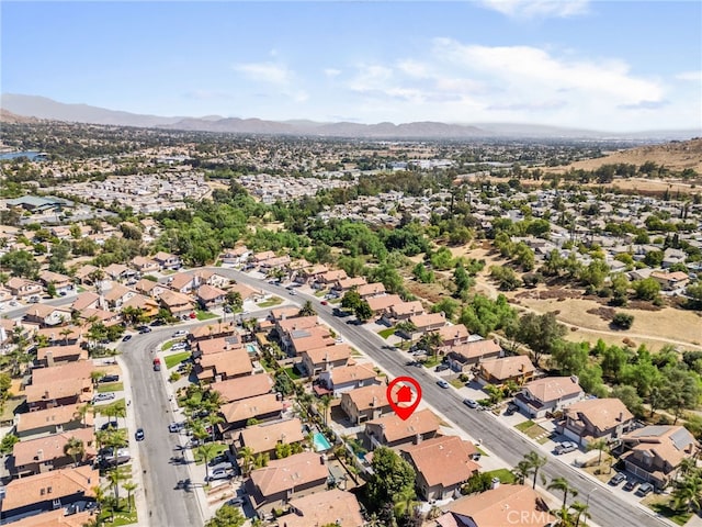 birds eye view of property featuring a mountain view