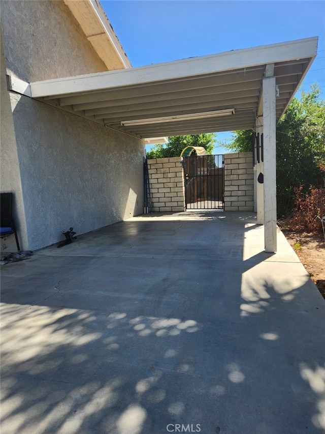 view of patio / terrace featuring a carport