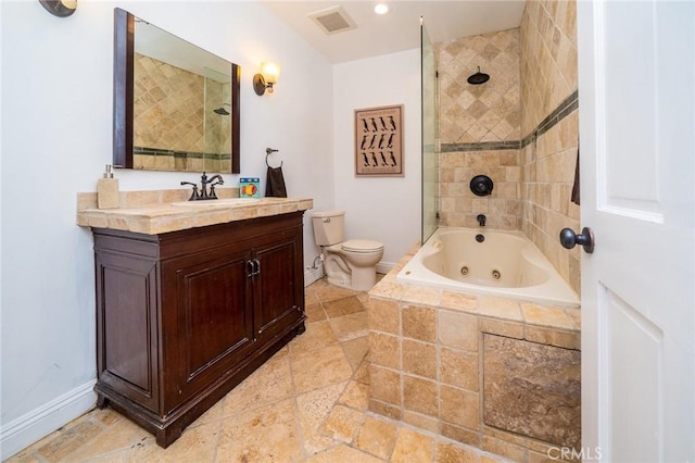 full bathroom with vanity, tiled shower / bath combo, and toilet