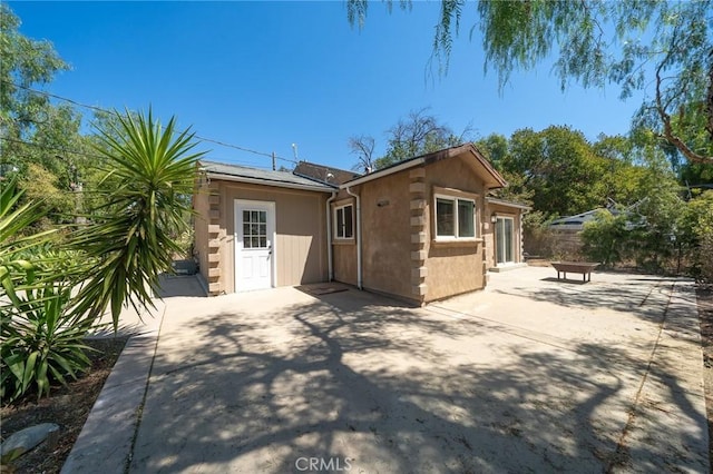 rear view of house featuring a patio