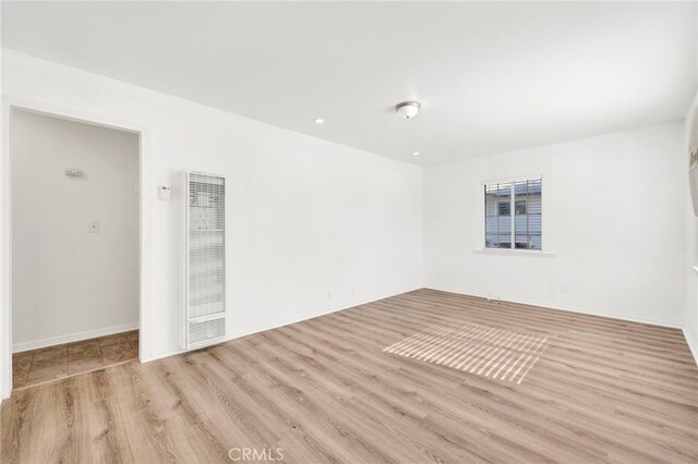 empty room with light wood-type flooring