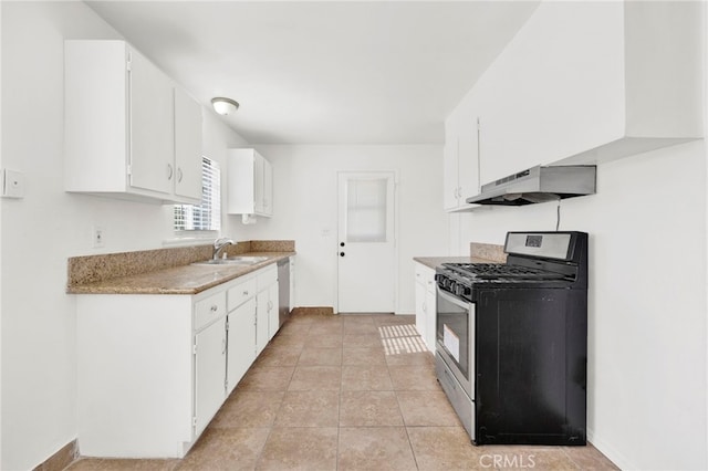 kitchen featuring white cabinetry, sink, light tile patterned flooring, and appliances with stainless steel finishes