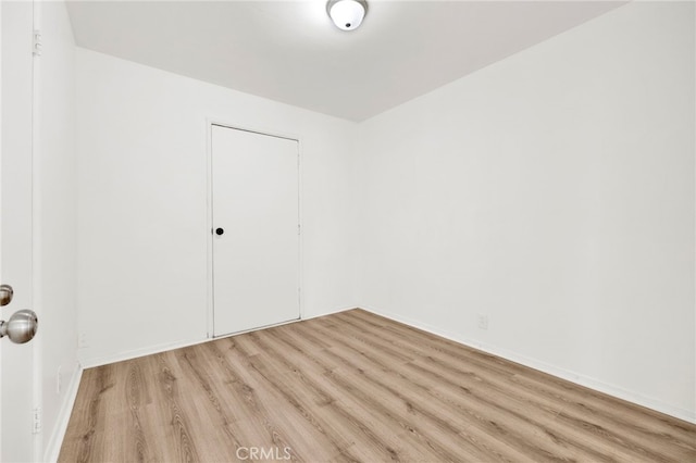 unfurnished room featuring light hardwood / wood-style flooring