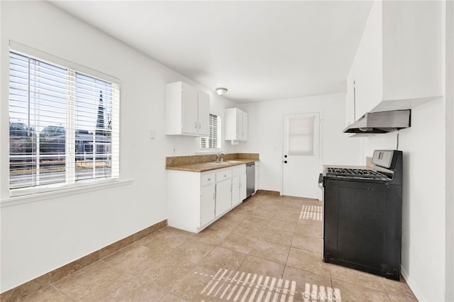 kitchen with dishwasher, sink, white cabinets, and gas range oven