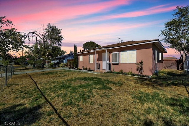 ranch-style house featuring a yard