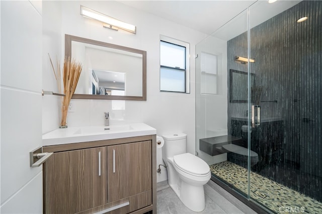 bathroom featuring vanity, toilet, and an enclosed shower