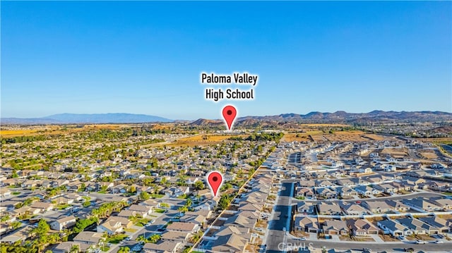 birds eye view of property featuring a mountain view