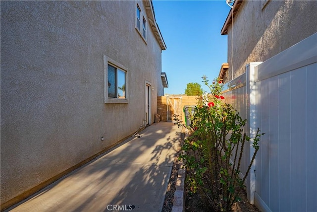 view of property exterior featuring a patio area