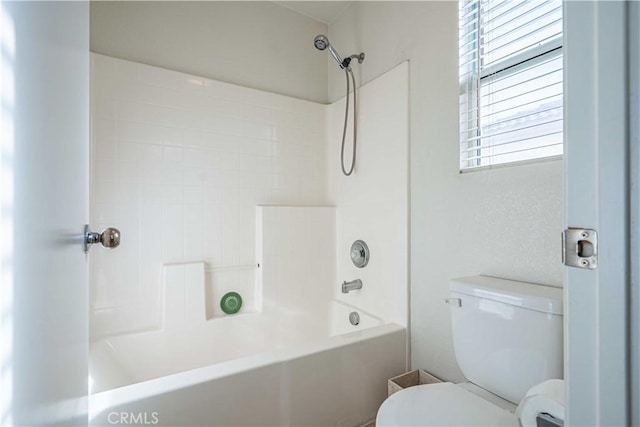 bathroom featuring toilet and shower / washtub combination