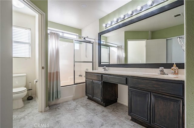 full bathroom with toilet, vanity, and combined bath / shower with glass door