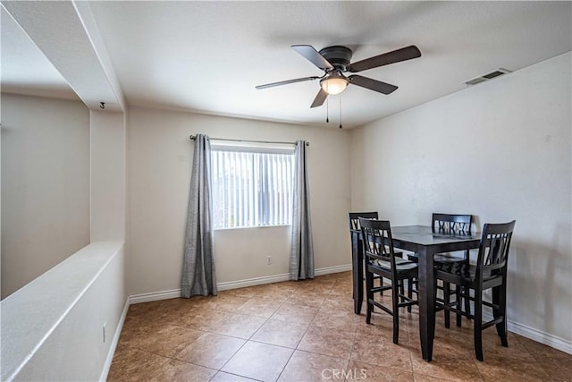 dining space featuring ceiling fan