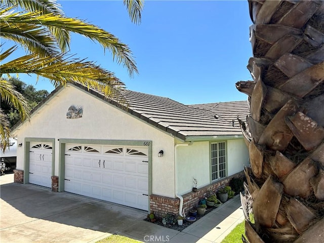 view of side of property featuring a garage