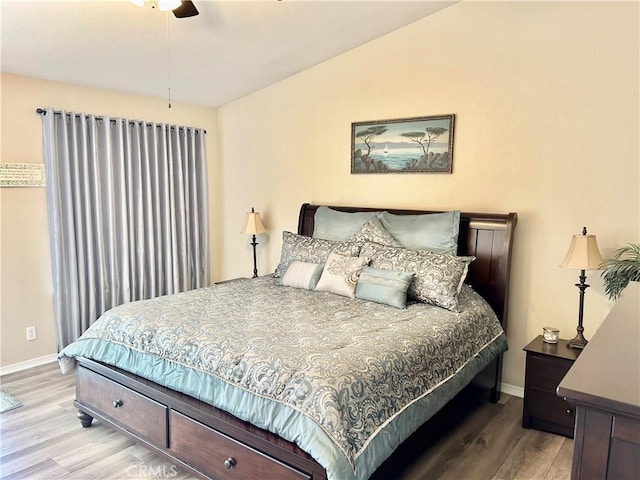 bedroom with ceiling fan and light hardwood / wood-style flooring