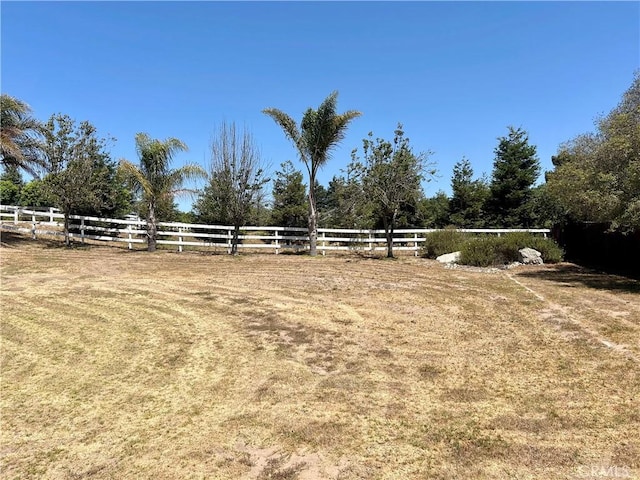 view of yard with a rural view