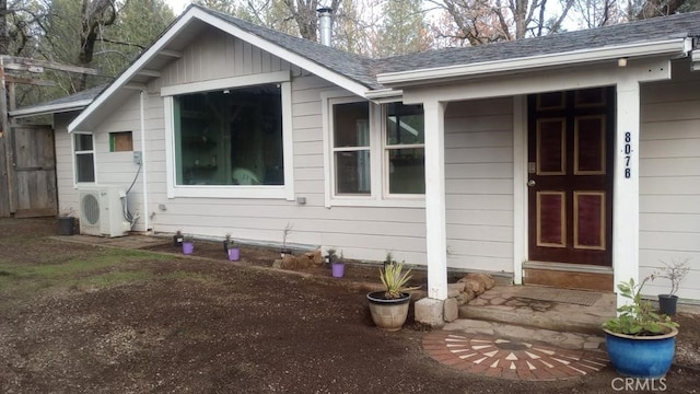 doorway to property featuring ac unit