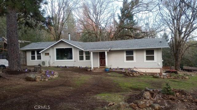 ranch-style house with ac unit