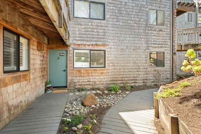 doorway to property with a wooden deck