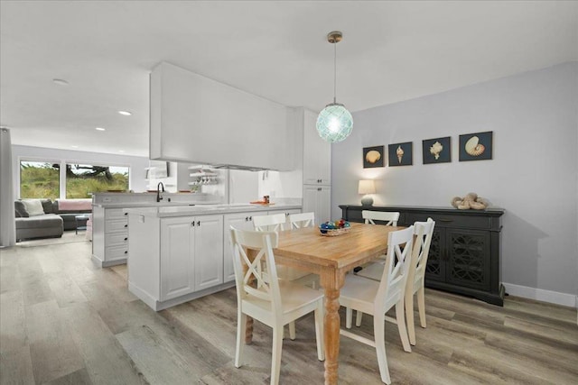 dining room with light wood-type flooring