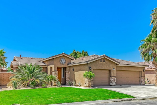 view of front of property featuring a garage and a front lawn