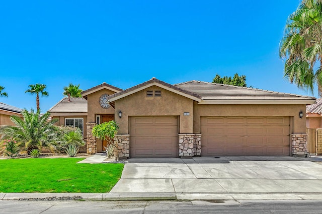 view of front of property featuring a front lawn and a garage