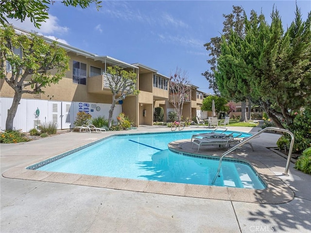 view of pool featuring a patio