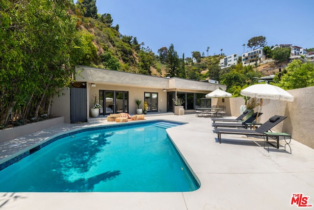 view of pool featuring a patio