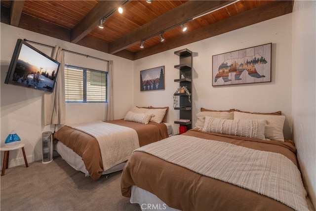 bedroom featuring track lighting, wood ceiling, beam ceiling, and carpet