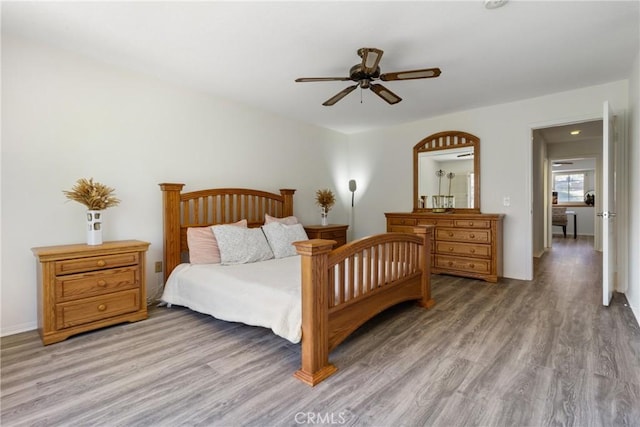 bedroom featuring ceiling fan and hardwood / wood-style flooring